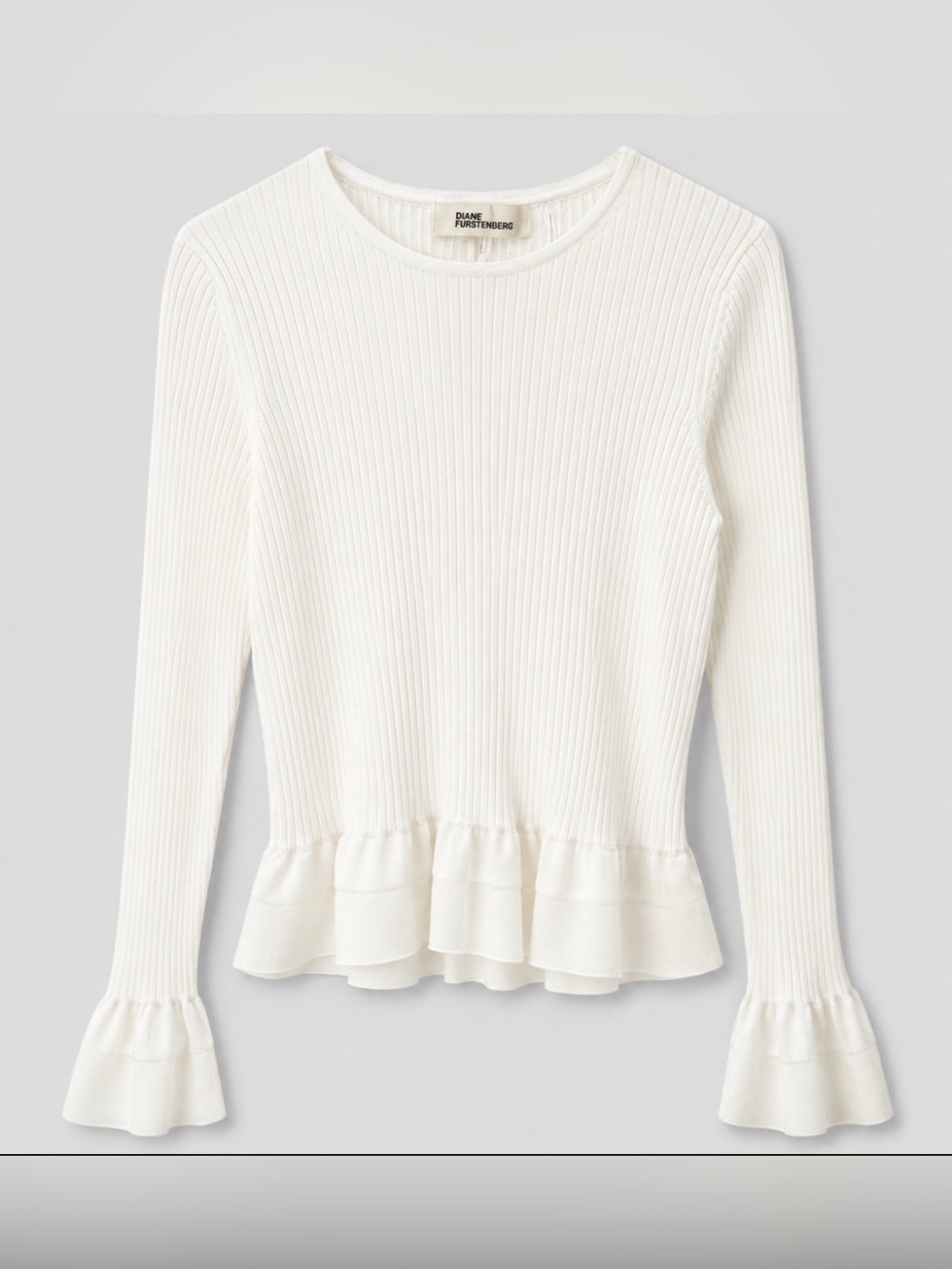Diane von Furstenberg Ivory Ribbed Long Sleeve Top with Ruffle Hem, size large.